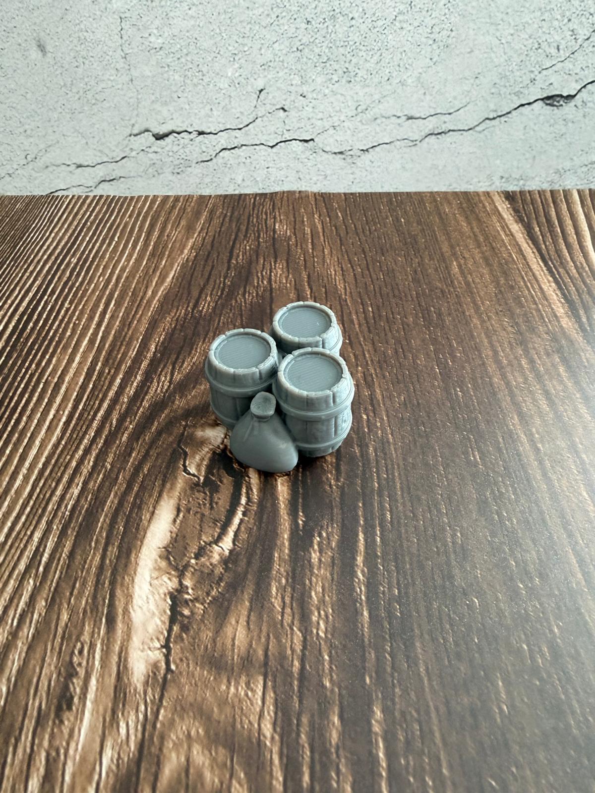 Fässer mit Sack und Kiste